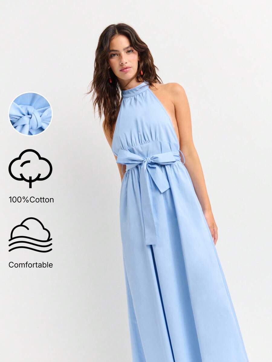 Nöista Light Blue Halter-Neck Maxi Dress With A Fitted Waist And Bow Belt. Flowing A-Line Silhouette. Back Features A Dramatic Ruffled Design And Open Detailing. . Elegant, Feminine, Chic, Airy, Sophisticated, Stylish, Comfortable, Versatile, Perfect For Summer Events And Evenings. - Blue - View 1