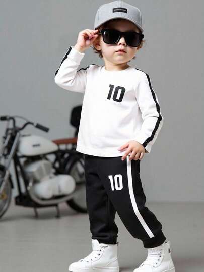 SHEIN 2件套男婴休闲纯色半开领侧开衩长袖T恤搭配松紧腰工装长裤套装，儿童服装，婴儿套装，适合夏季、度假、聚会、派对等场合。男婴套装，男婴运动服套装，黑白配色。