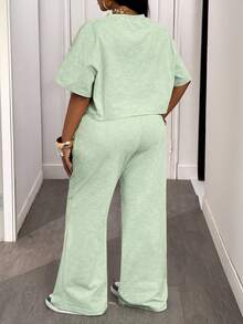 Slaydiva Bộ đồ hai mảnh thoải mái mùa hè và thu 2025 Áo thun ngắn tay cổ tròn màu xanh lá cây rộng rãi + Quần ống rộng buộc eo cho nữ, thích hợp cho du lịch hàng ngày, trở lại trường, tốt nghiệp Bộ đồ hai mảnh cho nữ Bộ đồ mặc nhà 2 mảnh thoải mái cho nữ Bộ đồ hai mảnh thường ngày cho nữ - màu xanh lá - Xem 3