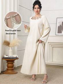 Al Najma Elegant Yellow Modest Abaya Dress For Women, Featuring A Unique Round Neckline With Pearl Beaded Cut-Out Details. This Long Sleeve Woven Fabric Gown, With Its Semi-Sheer And Subtle Rib-Knit Texture, Offers Grace And Style. Kaftan Jalabiya Dress - Yellow - View 1