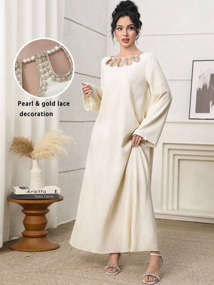 Al Najma Elegant Yellow Modest Abaya Dress For Women, Featuring A Unique Round Neckline With Pearl Beaded Cut-Out Details. This Long Sleeve Woven Fabric Gown, With Its Semi-Sheer And Subtle Rib-Knit Texture, Offers Grace And Style. Kaftan Jalabiya Dress - Yellow - View 1