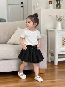 SHEIN Elladie kids Falda globo de línea A de unicolor para niñas pequeñas. El tono de unicolor exhibe un estilo elegante y el diseño de burbuja le agrega un toque lindo. La silueta de línea A favorece la figura, adecuada para bebés de todos los tipos de Body. Ya sea para juegos al aire libre, descanso casual en casa, actividades cotidianas o ocasiones especiales, esta falda permitirá que su pequeña princesa muestre su encanto único y disfrute de momentos felices. - Negro - Ver 7