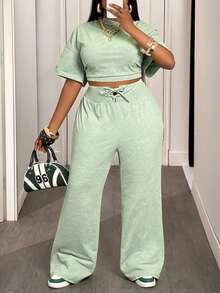 Slaydiva Bộ đồ hai mảnh thoải mái mùa hè và thu 2025 Áo thun ngắn tay cổ tròn màu xanh lá cây rộng rãi + Quần ống rộng buộc eo cho nữ, thích hợp cho du lịch hàng ngày, trở lại trường, tốt nghiệp Bộ đồ hai mảnh cho nữ Bộ đồ mặc nhà 2 mảnh thoải mái cho nữ Bộ đồ hai mảnh thường ngày cho nữ - màu xanh lá - Xem 4