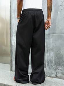 Manfinity Streetrush Pantalones de pierna ancha con cordón en la cintura, bolsillos y tachuelas con forma de pentagrama para hombres
