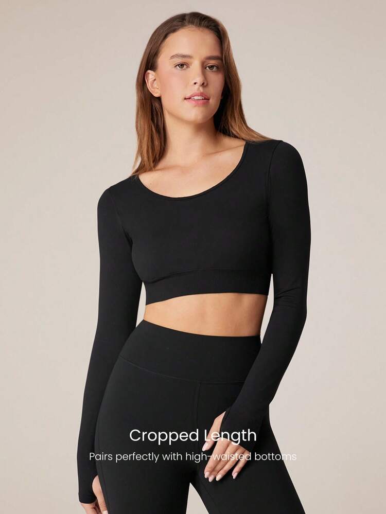 Maglia crop a maniche lunghe attillata e senza cuciture con lacci sul retro. Supporto leggero per yoga a basso impatto per luso quotidiano