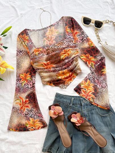 Soleia Dambrun leopardblommig topp med fyrkantig halsringning, utsvängda ärmar och rynkad asymmetrisk fåll. Lämplig för semester, dejt, eftermiddagste, ö-semester, strandkryssning, stadsresa, musikfestival, bohemisk semester. Kan bäras inomhus eller utomhus, vardagskläder.