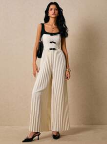 Poéselle Damen Jumpsuit mit Schleifendekor und weitem Bein - Schwarz und Weiss - Übersicht 1