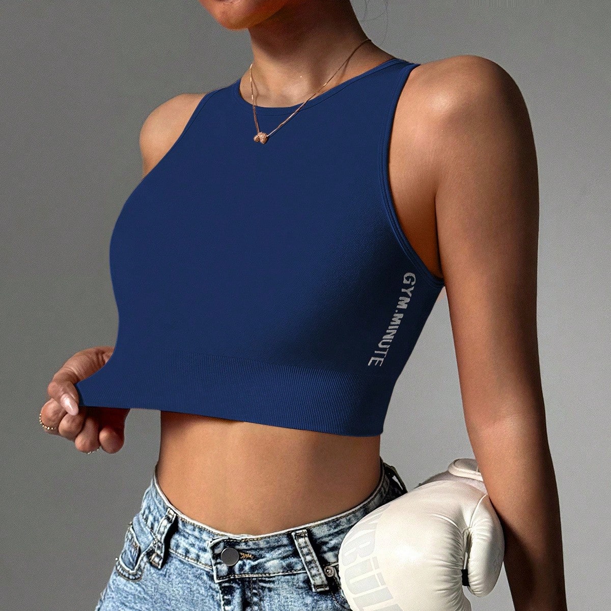 Top deportivo tipo camiseta de punto acanalado, ajustado, sin mangas y corto para hacer ejercicio