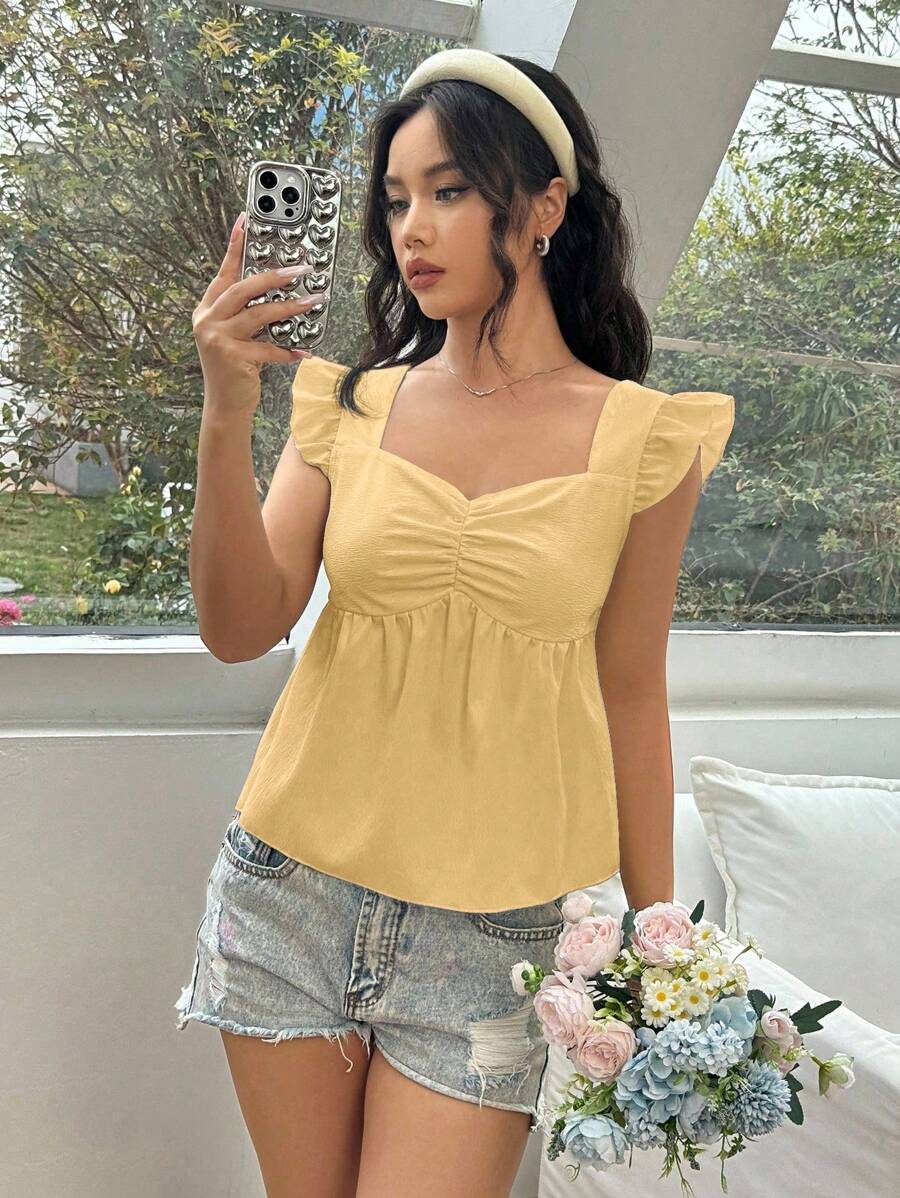 SHEIN Unity Blusa amarilla con textura de unicolor, fruncido en el pecho y cuello en forma de corazón con volante - Albaricoque - Ver 1