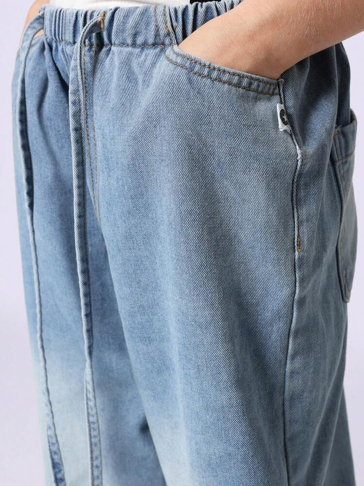 Jeans a gamba larga con coulisse in vita