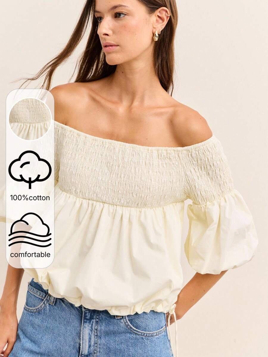 Nöista 这款露肩白色衬衫采用褶饰领口、蓬松泡泡袖和宽松褶边设计，体现了复古的 Y2K 和 Old Money 风格，非常适合秋冬季女性街头服饰。 - 杏色 - 查看 1