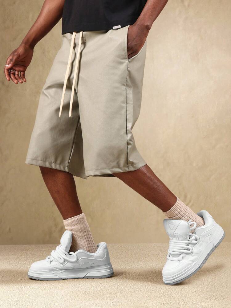 Shorts largos com cordão e bolsos laterais