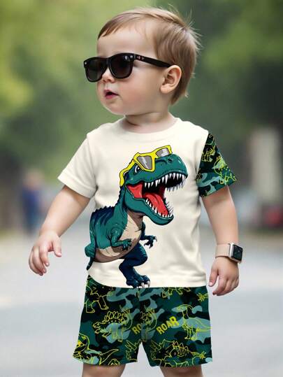 SHEIN 2pcs/Set Young Boy Casual Style Military Green Dinosaur Cartoon Animal Camo Y2K Sporty Vacation Round Neck Short Sleeve Shorts Set, Suitable For Summer