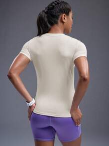 Powerista Solid Color Fitted Round Neck Asymmetric Hem Short Sleeve Athletic T-Shirt Gym Women Shirts - Beige - View 2