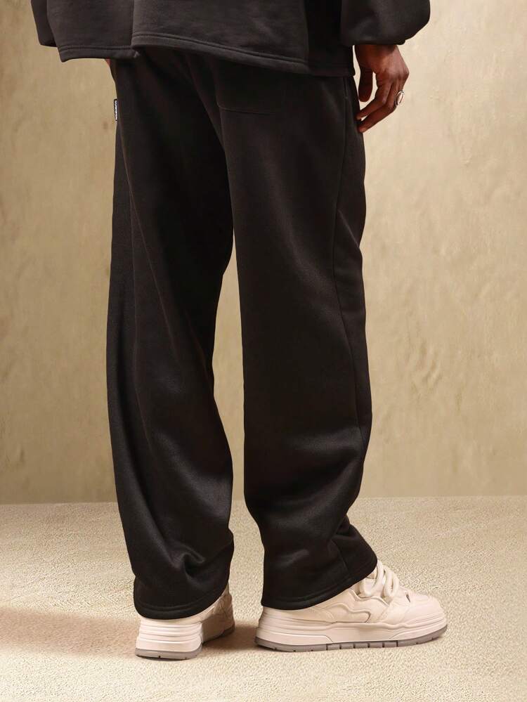 Pantaloni della tuta con cavallo basso, caviglie elastiche e coulisse