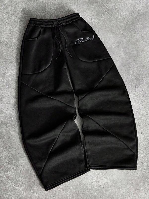 Manfinity Streetrush Pantalones de chándal anchos de moda para hombres con parches creativos y bordado de letras en negro