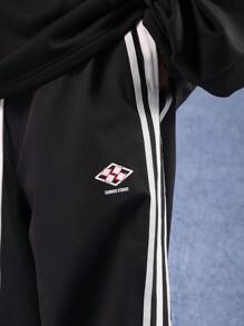 SUMWON Pantaloni sportivi larghi con bande laterali, pantaloni da allenamento ad alte prestazioni, abbigliamento sportivo in nylon per palestra, corsa e competizioni