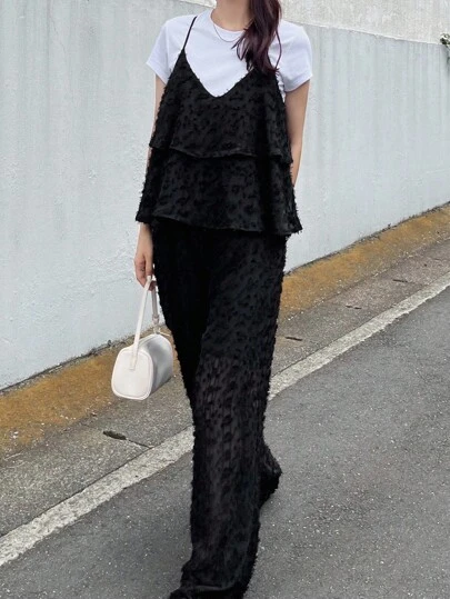 FRIFUL 女式黑色纯色细肩带荷叶边下摆露背系带腰部宽松连体裤