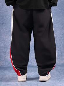 SUMWON Pantaloni sportivi larghi con bande laterali, pantaloni da allenamento ad alte prestazioni, abbigliamento sportivo in nylon per palestra, corsa e competizioni