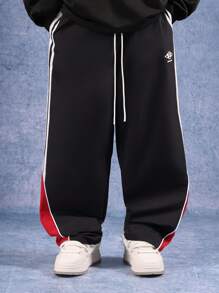 SUMWON Pantaloni sportivi larghi con bande laterali, pantaloni da allenamento ad alte prestazioni, abbigliamento sportivo in nylon per palestra, corsa e competizioni