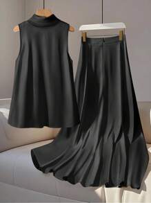 GlowEve Bộ 2 món áo và chân váy thanh lịch không tay bằng vải satin có nơ cổ đứng dành cho nữ - màu đen - Xem 2