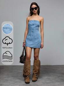 TypaGal 复古水洗牛仔抹胸连衣裙，采用优质轻盈牛仔布，呈现清新淡蓝色调。露肩设计展现优雅的锁骨，前后垂直接缝则拉长身形。简洁纯粹的设计搭配经典的口袋细节，是休闲约会或海滩度假的完美之选。