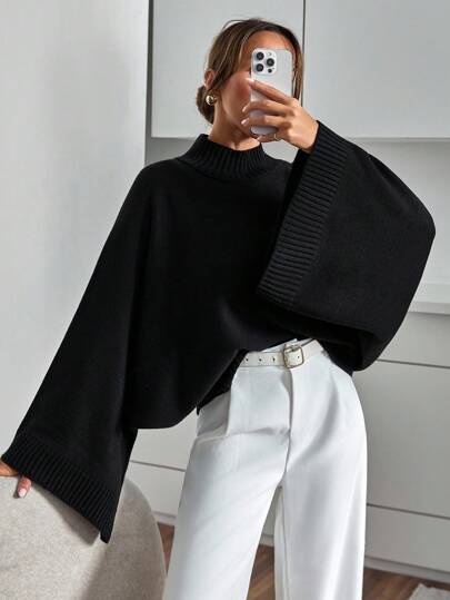 SHEIN Elegante suéter de punto con mangas de murciélago en negro, con un ajuste relajado y oversize, y una elegancia minimalista y desenfadada