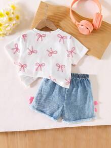 Elladie kids Bộ đồ bé gái thường ngày ngọt ngào gồm áo thun ngắn tay cổ tròn in nơ và quần short denim cạp chun có nơ, thích hợp mặc hàng ngày. Bộ quần áo mùa hè cho bé gái, áo thun ngắn tay có nơ và quần short denim, trang phục mùa hè cho bé gái. - trắng - Xem 3