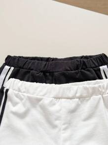 Conjunto informal de cuatro piezas para bebé que incluye sudadera con cuello redondo acanalado y manga raglán, pantalones cortos y bloques de color para niño y niña - Blanco y Negro - Ver 5