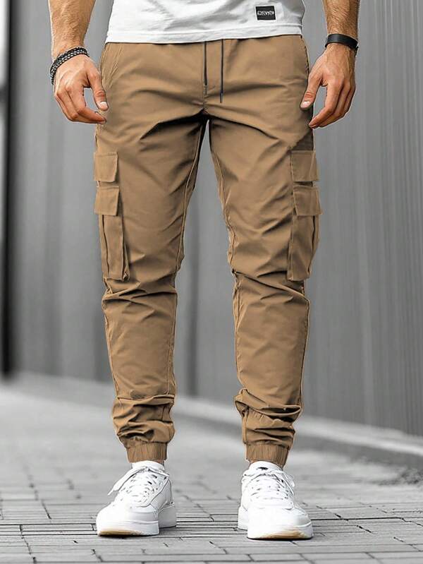 Manfinity Homme Pantalones cargo casuales de calle para hombres de unicolor con cordón en la cintura y bolsillo con solapa, pantalones cargo marrones, pantalones cargo caqui para otoño
