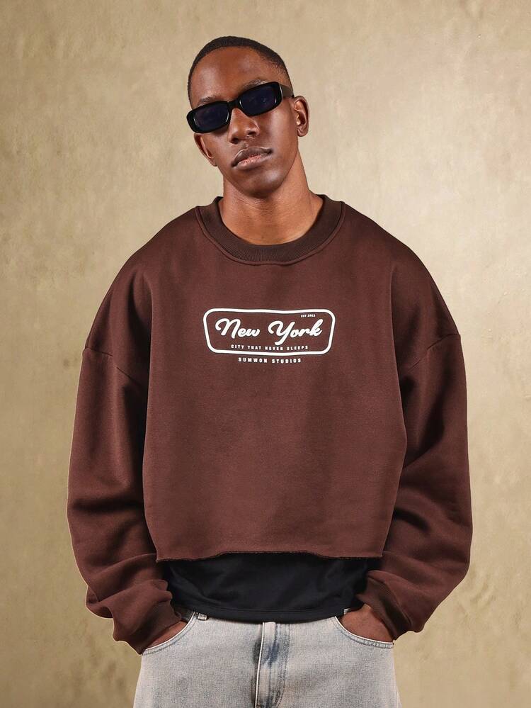 Kurzes Sweatshirt mit offenem Saum und Stadtlogo