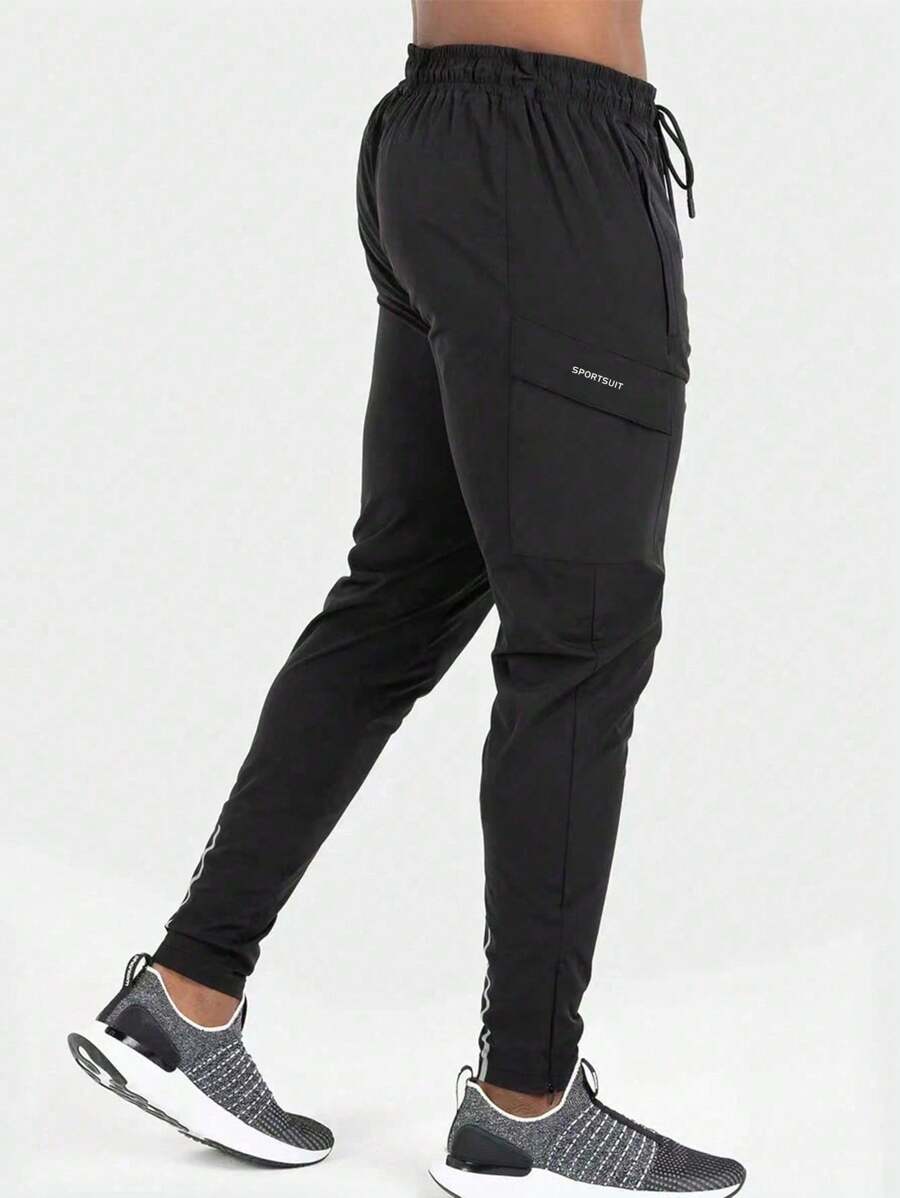 Manfinity Fitness Pantalon de sport pour homme style petit ami avec taille à cordon, poches latérales avec rabat, idéal pour l'automne, respirant