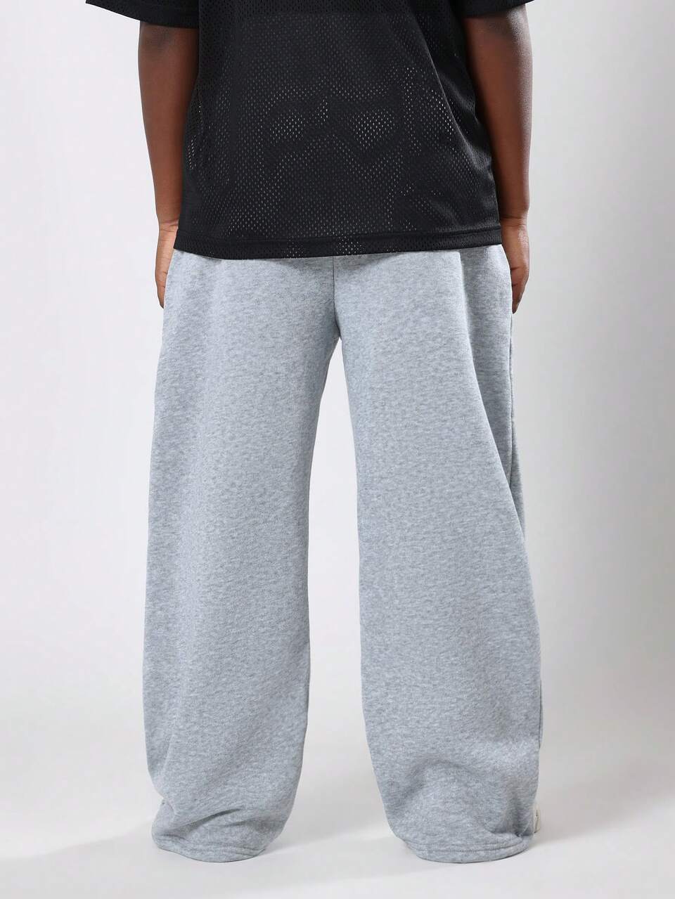 Pantalones deportivos anchos jaspeados con cintura con cordón
