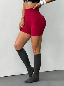 Dewbera Pantalones cortos deportivos elásticos sin costuras de cintura alta de unicolor