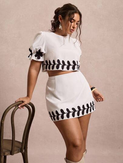 Freevana Conjunto de 2 piezas para mujer de talla grande con top de manga abullonada y falda mini con estampado floral para vacaciones