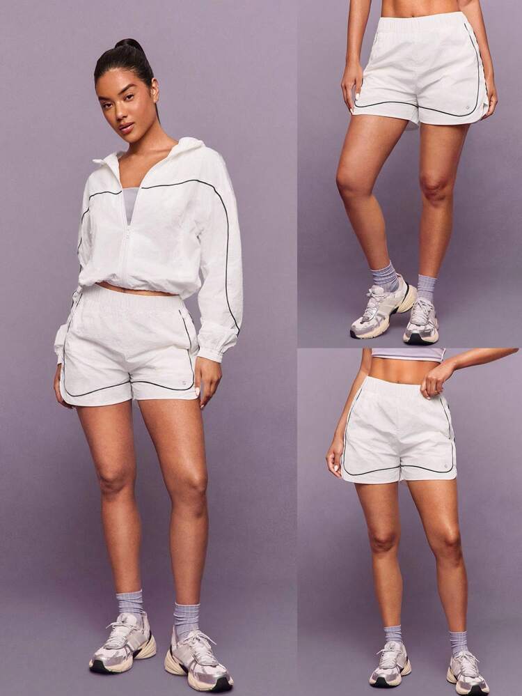 Short de coupe-vent léger record avec sous-vêtement intégré, coutures contrastées, poches, fermeture éclair. Idéal pour la course, le jogging, la gym, l'entraînement et le port casual quotidien