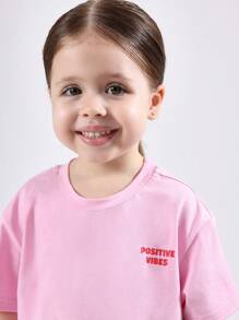 SUMWON T-shirt en coton d'été décontracté pour filles avec imprimé de personnage "Vibrations positives à la vitamine C". Design de dessin animé heureux pour un port quotidien de jeunesse