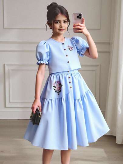 2 件套青少年女孩复古印花泡泡袖衬衫搭配不对称纽扣裙，舒适的春夏假日装