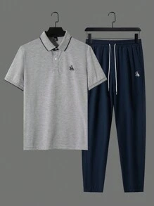 Manfinity Homme 2 pezzi Set uomo estivo casual, composto da polo shirt con stampa grafica e bordi a contrasto, e pantaloni lunghi con vita con coulisse