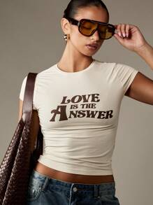 MISSGUIDED 爱是答案婴儿 T 恤复古 70 年代风格图案印花短袖修身短款上衣节日夏季 Y2K 街头潮流 T 恤 - 杏色 - 查看 5