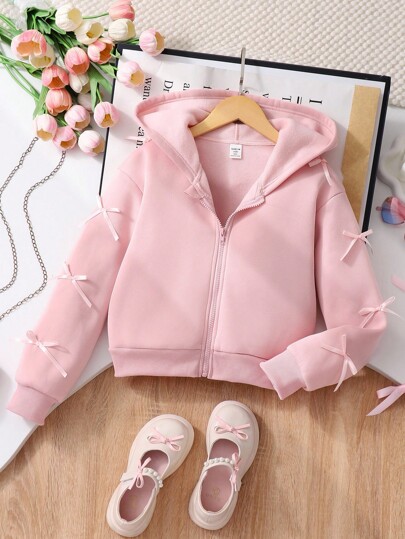 SHEIN 少女外套，纯色时尚蝴蝶结装饰卫衣，舒适加厚保暖连帽面料，袖口蝴蝶结装饰，青春活力少女风，适合返校或休闲户外穿着，秋冬季节。