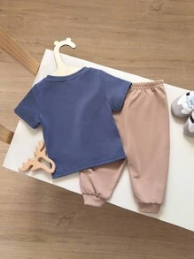 2 件套男婴可爱狮子图案短袖 T 恤和裤子套装，舒适休闲时尚服装适合春夏季室内、户外、日常穿着、运动、玩耍、派对、拍照、度假、节日 - 棕色 - 查看 2