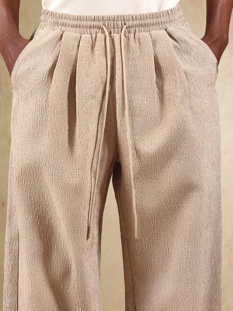 끈과 옆주머니가 달린 와이드 레그 텍스처 팬츠