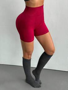 Dewbera Pantalones cortos deportivos elásticos sin costuras de cintura alta de unicolor