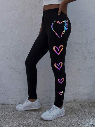 Ung flicka casual streetchic åtsittande leggings med hjärtmönster som lyser i mörkret