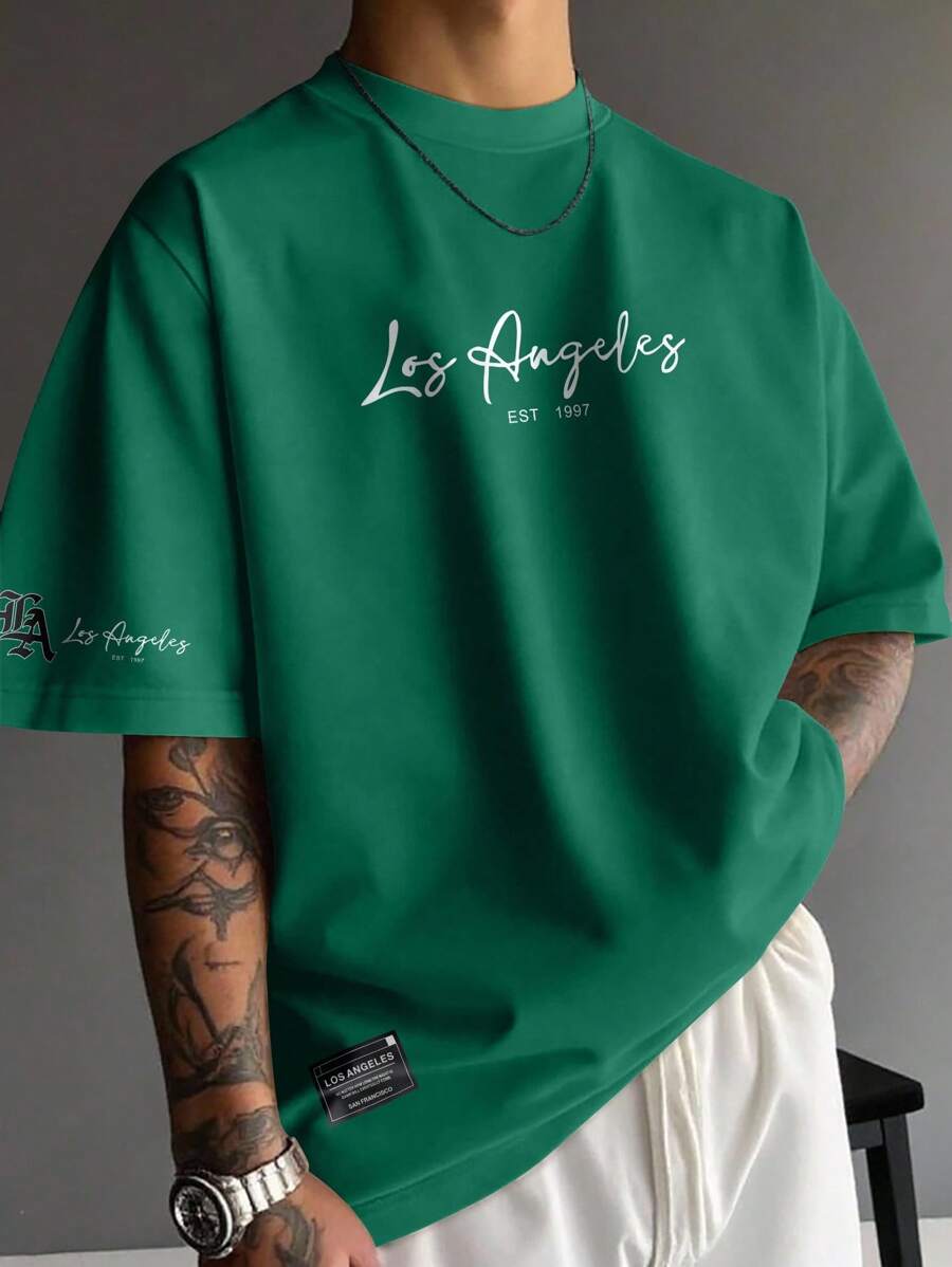 Manfinity EMRG Camiseta casual de verano para hombres con cuello redondo y estampado de letras, de corte holgado - Verde Oscuro - Ver 1