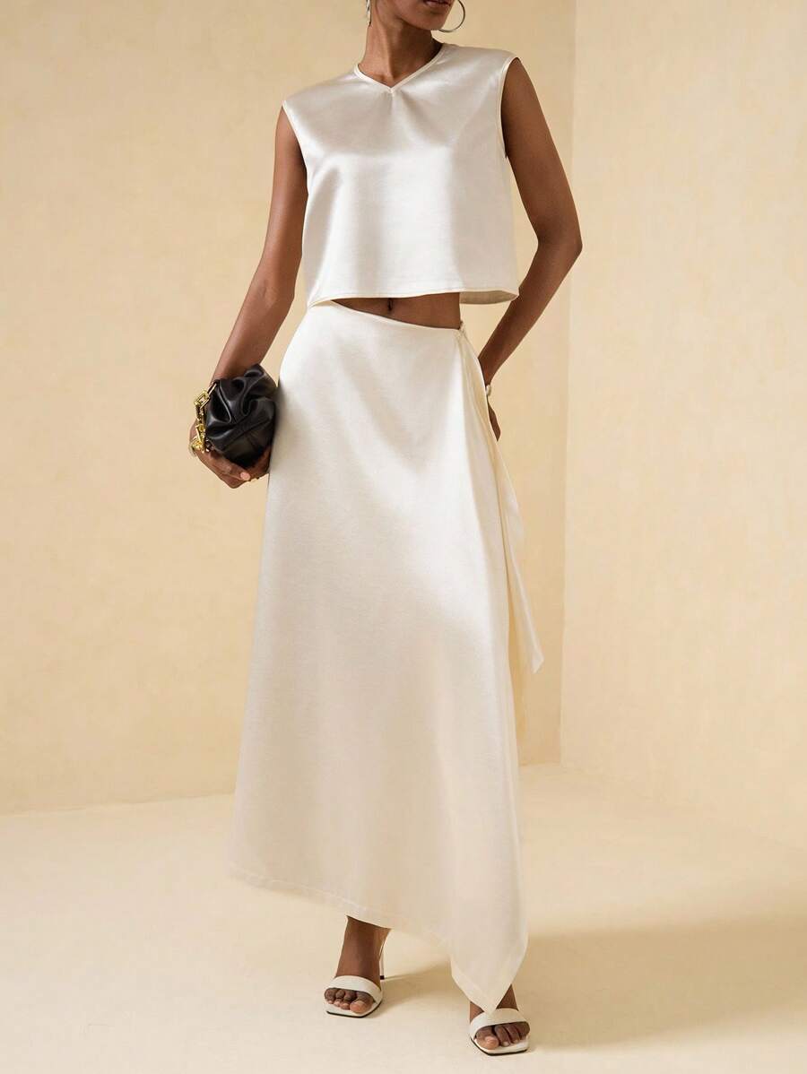 Vesra Conjunto de 2 piezas para mujer compuesto por una blusa de satén brillante con escote en V, holgada y corta sin mangas con bajo asimétrico y con volantes, y una falda con cintura elástica, en color albaricoque. Elegante, de lujo y versátil, apto para múltiples ocasiones. - Albaricoque - Ver 1