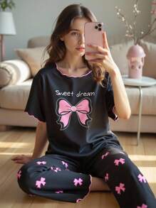 青少年女孩睡衣套装，黑色背景，粉色蝴蝶结上衣，全身蝴蝶印花裤，波浪撞色饰边，短袖和长裤休闲睡衣，返校时尚 - 黑色 - 查看 3