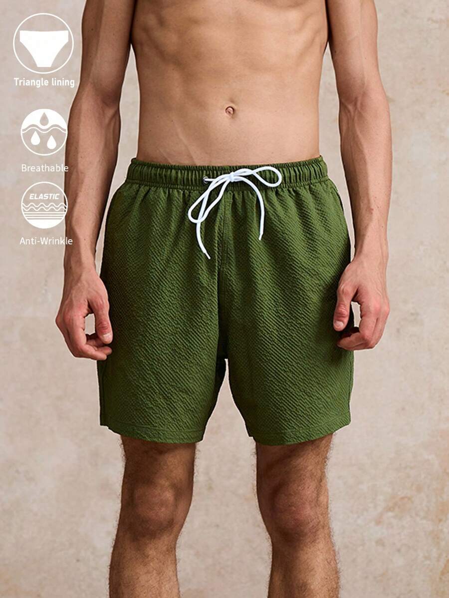 Surfspeed Pantalones cortos de playa para hombres de unicolor con cordón en la cintura y bolsillos - Verde militar - Ver 1