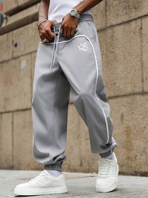 Manfinity EMRG Casual Men's Drawstring Waist Printed Star Pants With Ankle Cuffs